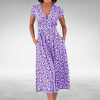 Flowing A-Line Midi Dress with Defined Waist and Delicate Floral Pattern Purple